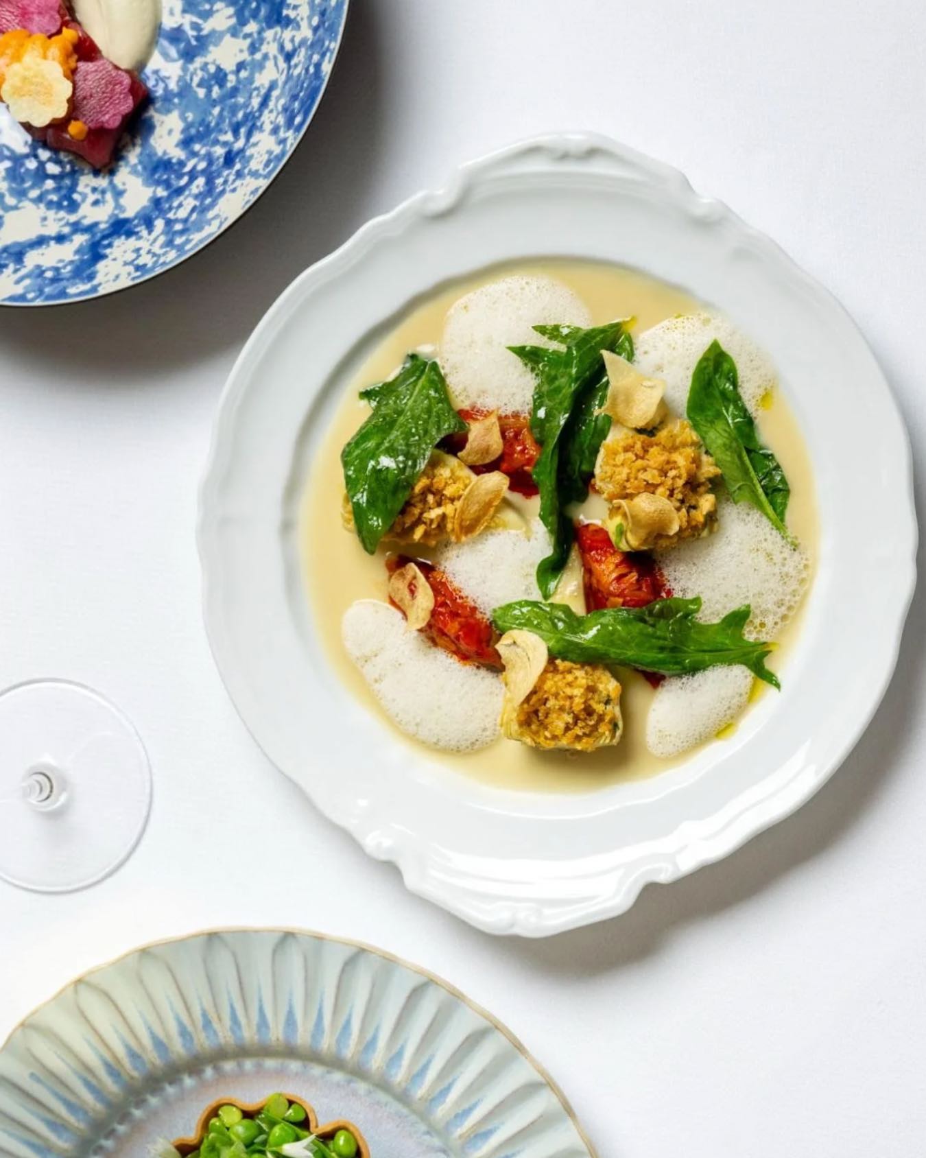 This dish from Café Carmellini brings the flavors of Provence to NoMad, with artichokes stewed in caper and anchovy butter, finished in a lightly frothed fennel sauce and garnished with crispy breadcrumbs.